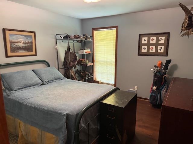 525 Middleton Loop Bolivar, TN 38008 - Photo 9 of 13 a bedroom with a bed and wooden floor