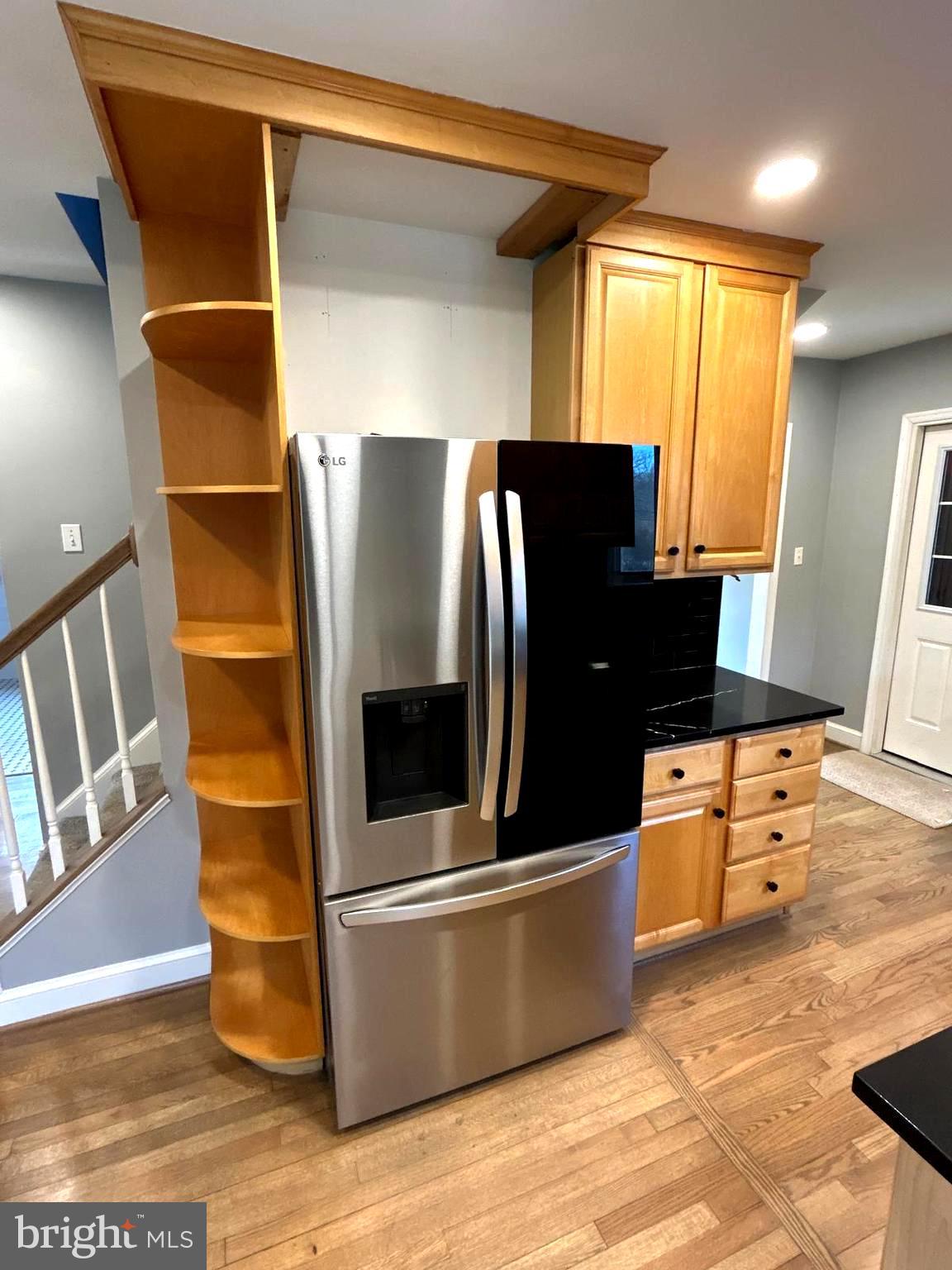 4630 Muncaster Mill Road Rockville, MD 20853 - Photo 12 of 40 a kitchen with stainless steel appliances wooden cabinets and granite counter tops