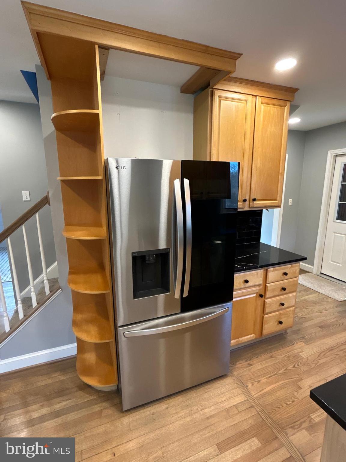 4630 Muncaster Mill Road Rockville, MD 20853 - Photo 14 of 40 a kitchen with stainless steel appliances wooden cabinets and granite counter tops