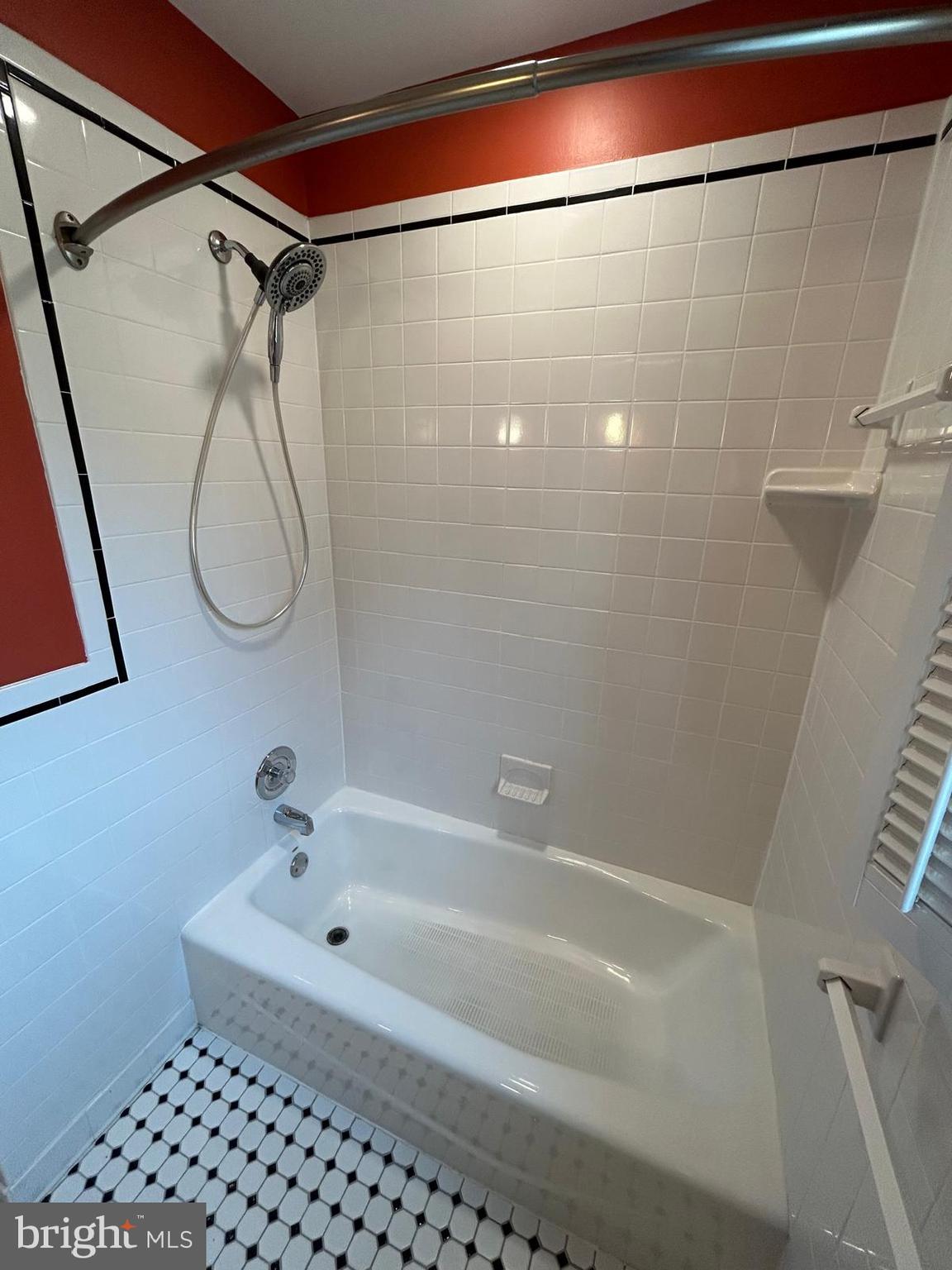 4630 Muncaster Mill Road Rockville, MD 20853 - Photo 19 of 40 a bathroom with a bath tub and a shower