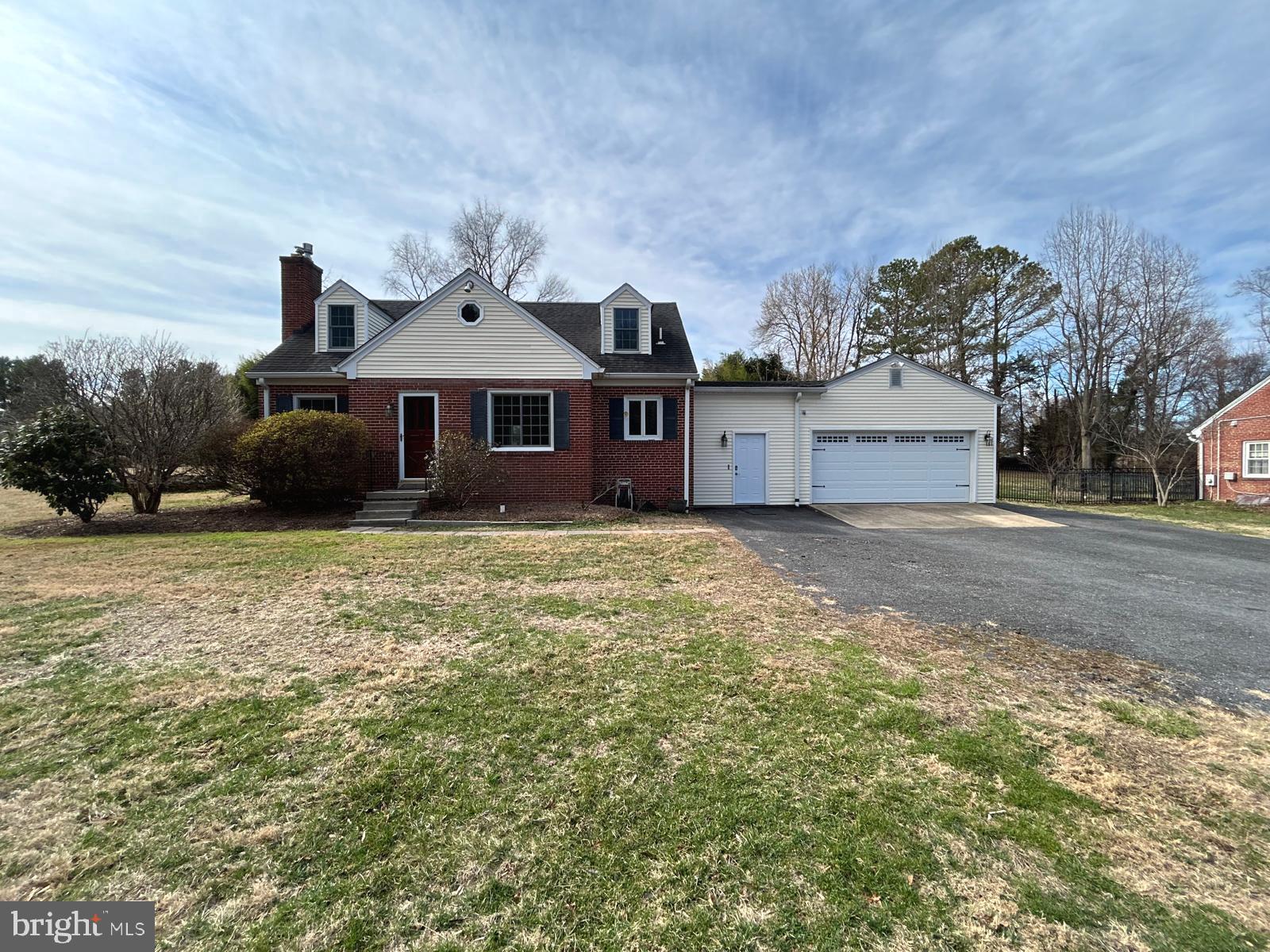 4630 Muncaster Mill Road Rockville, MD 20853 - Photo 2 of 40 a front view of a house with a yard and garage