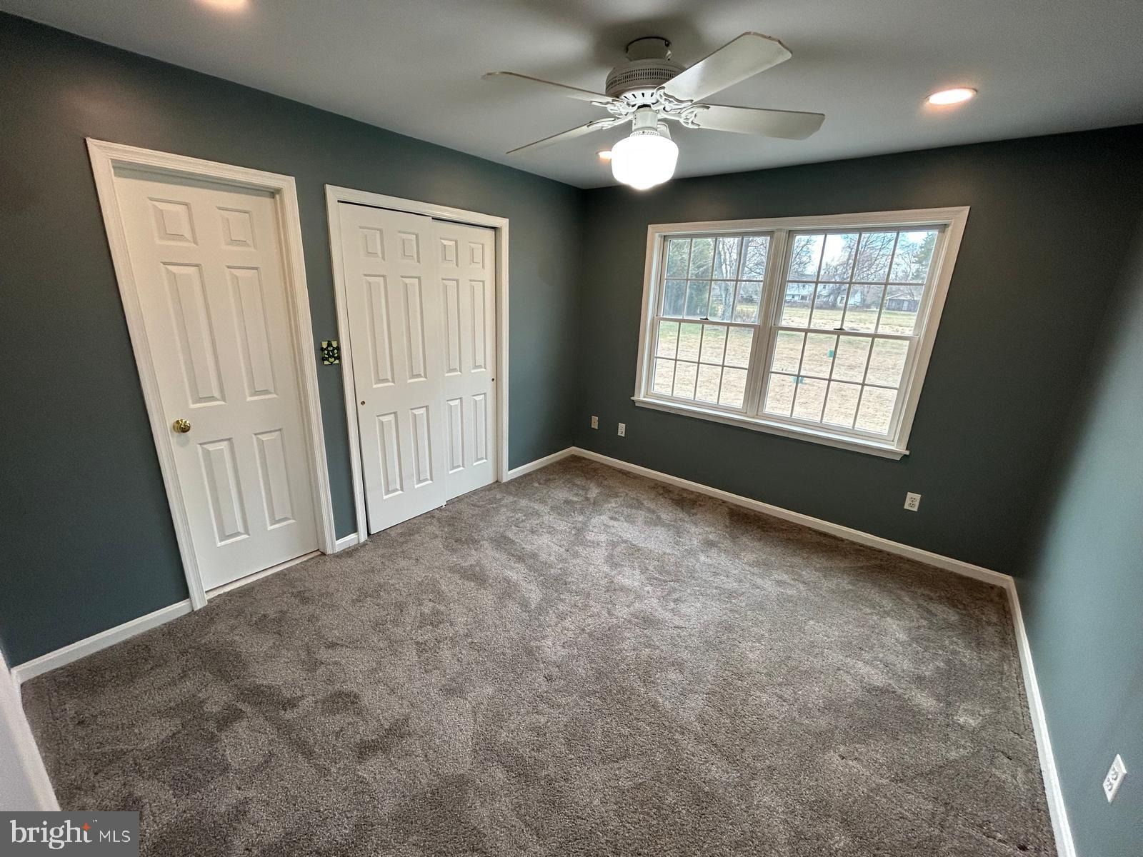 4630 Muncaster Mill Road Rockville, MD 20853 - Photo 23 of 40 an empty room with windows and fan