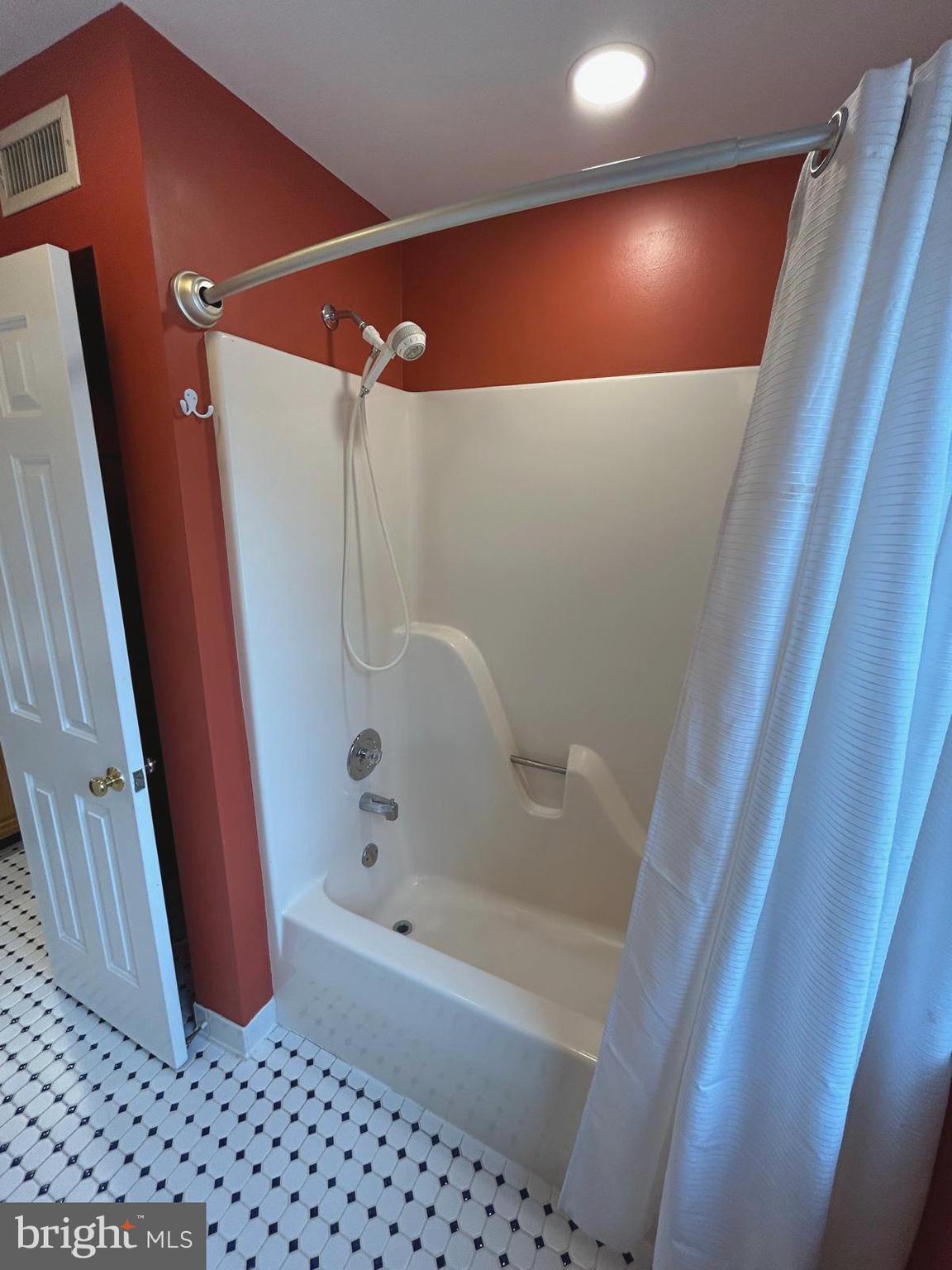 4630 Muncaster Mill Road Rockville, MD 20853 - Photo 28 of 40 a bathroom with a bathtub and shower