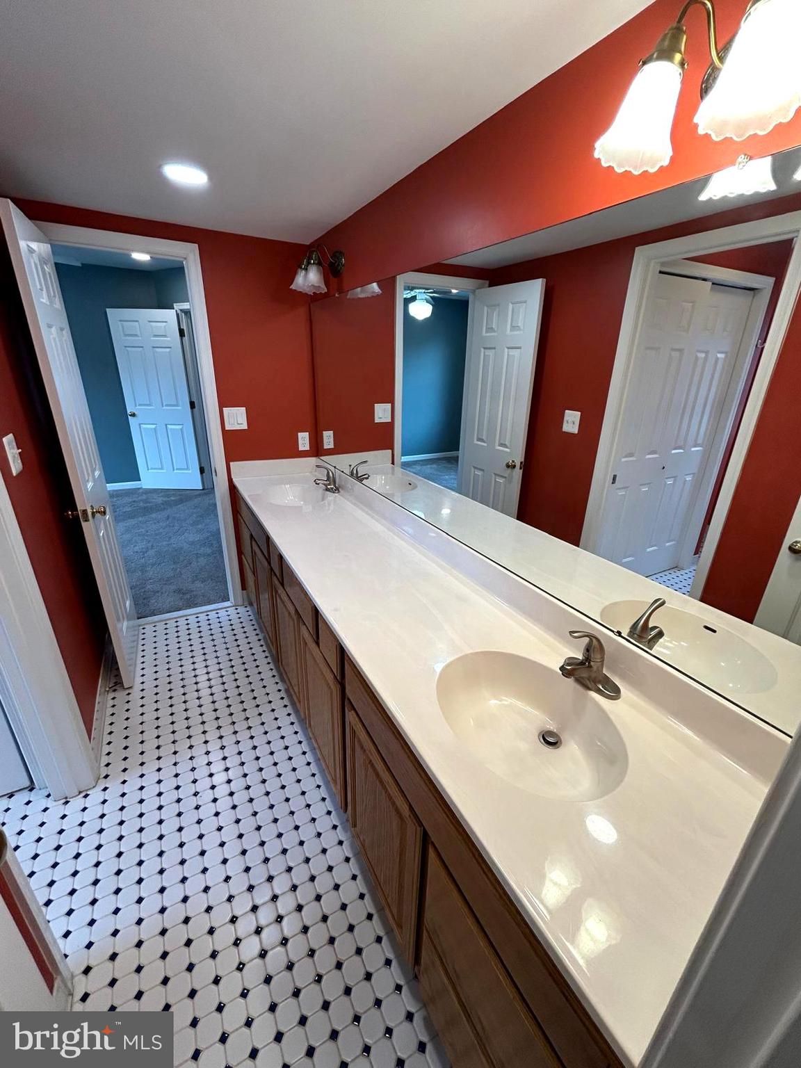 4630 Muncaster Mill Road Rockville, MD 20853 - Photo 29 of 40 a bathroom with a sink shower and a mirror