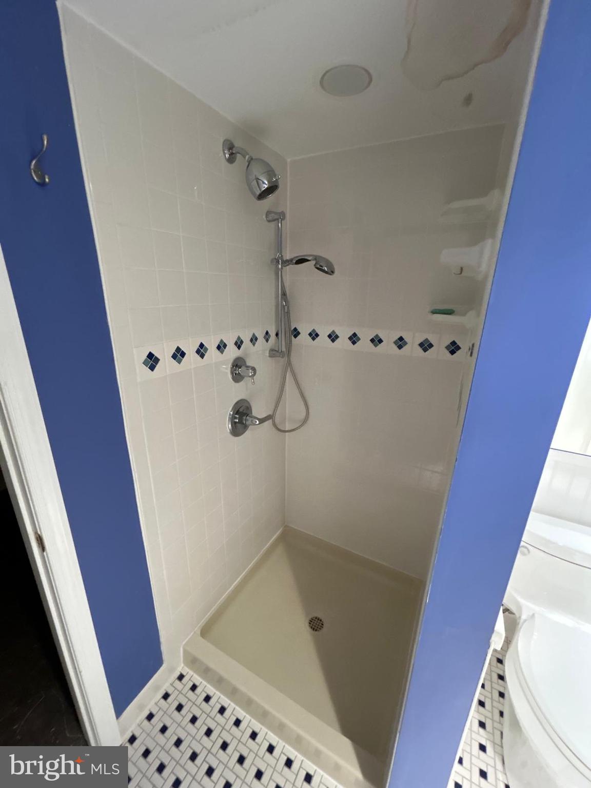 4630 Muncaster Mill Road Rockville, MD 20853 - Photo 34 of 40 a bathroom with a shower and a toilet