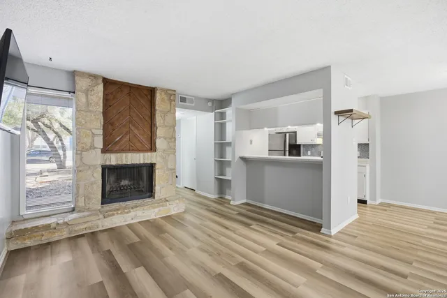 a view of a livingroom with a fireplace