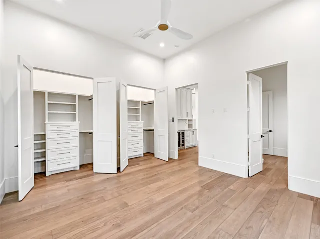 a bathroom with a granite countertop sink mirror and a shower