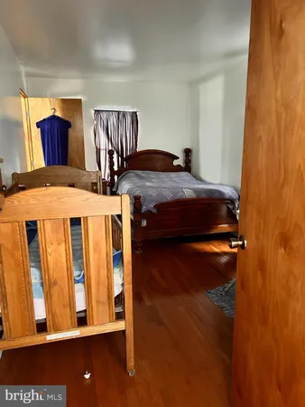 a living room with furniture a window and a kitchen