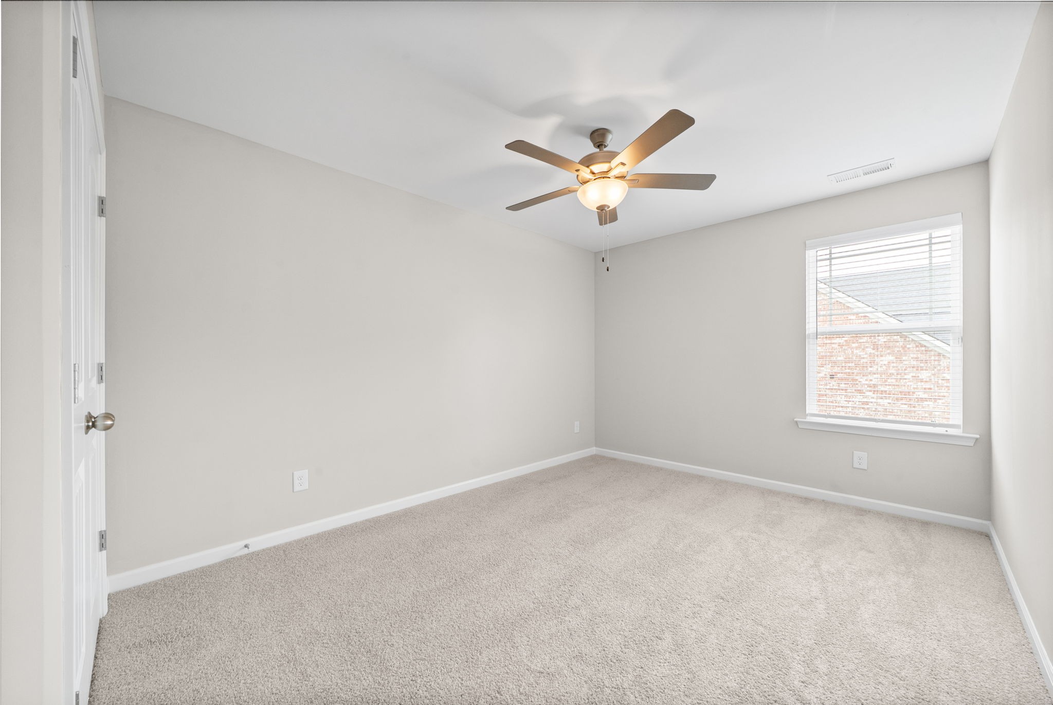 719 Reflections Lane Pleasant View, TN 37146 - Photo 29 of 46 an empty room with a window and a fan