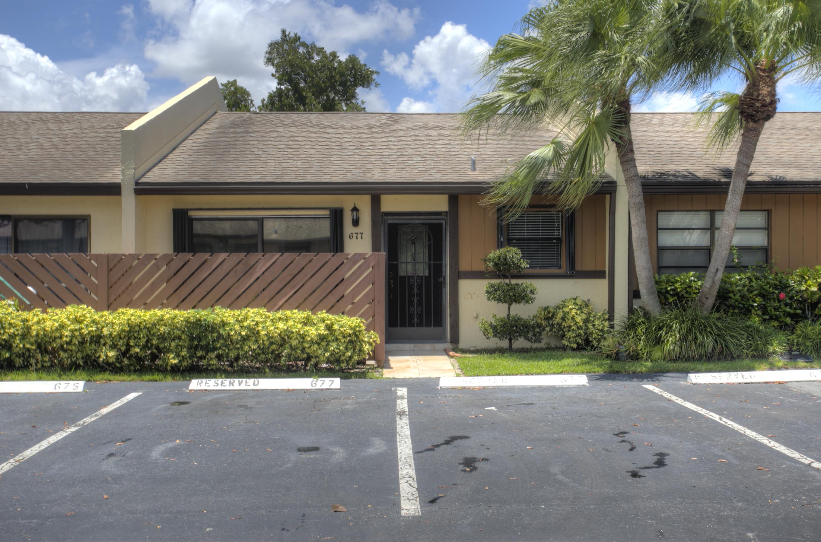 677 Banks Road Margate, FL 33063 - Photo 4 of 25 a front view of a house with a yard and outdoor seating