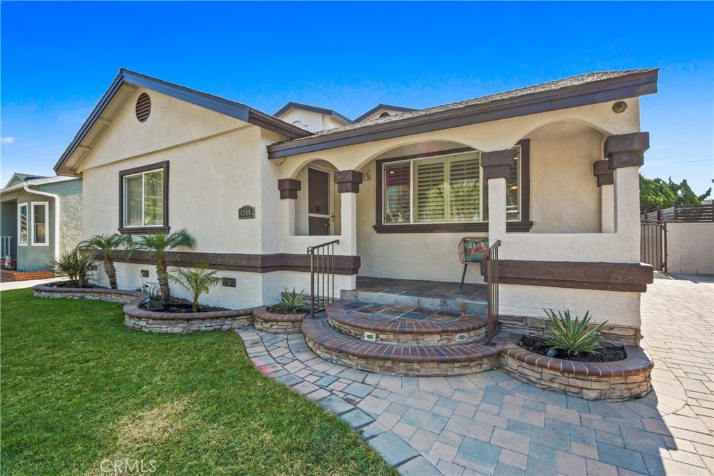 a front view of a house with garden