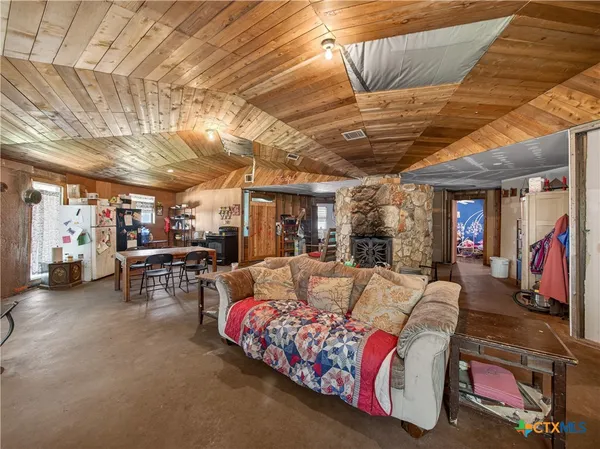 a kitchen with storage and utility