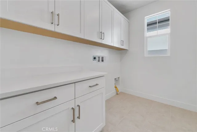 a view white cabinets and wooden floor
