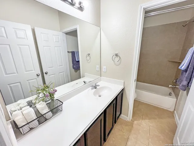 a white toilet sitting next to a bath tub