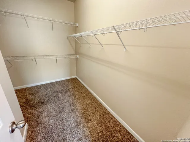 a view of a room with racks on the wall