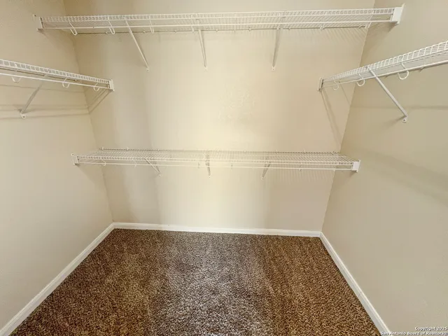 a view of a balcony with wooden floor