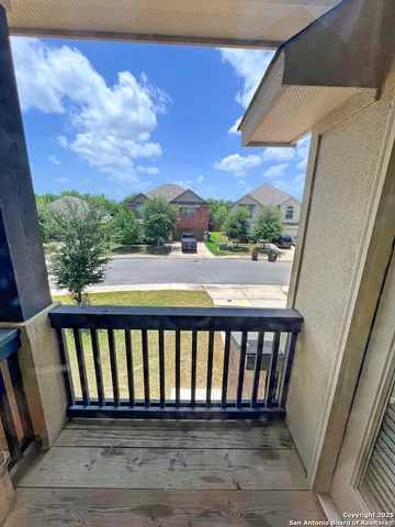 a view of a livingroom with wooden floor and a window