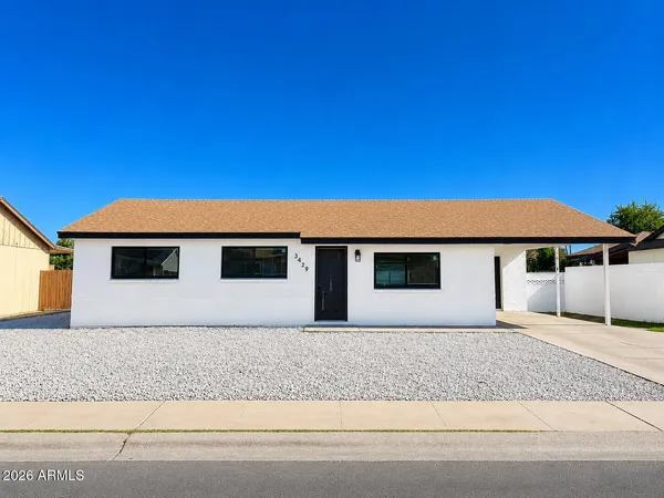 a front view of a house with a garage