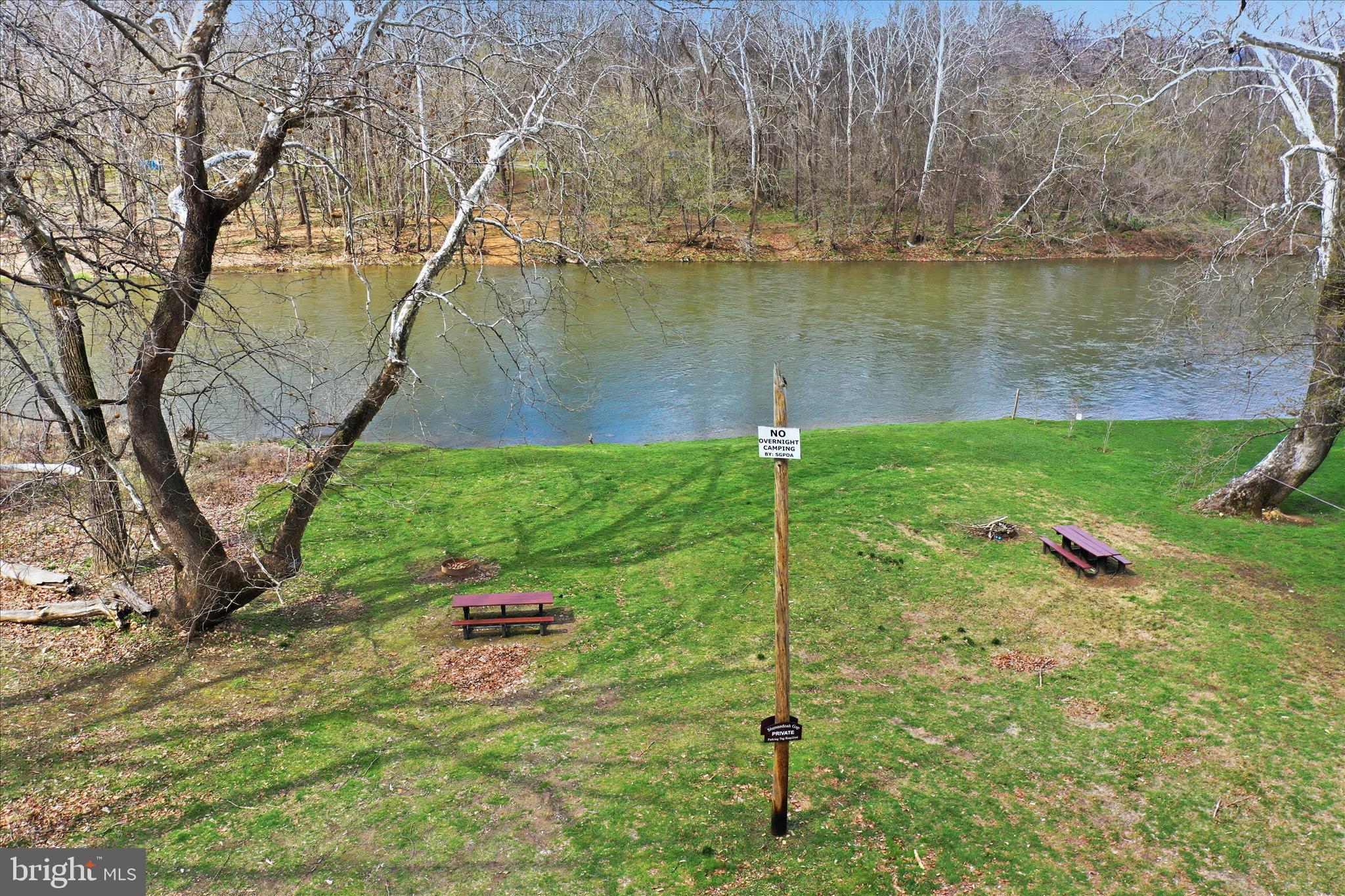 509 River View Place Shenandoah, VA 22849 - Photo 36 of 39 a backyard of a house with lots of green space and lake view