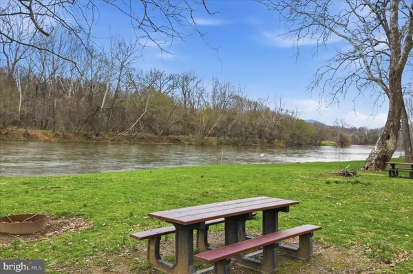 a view of a wooden deck and a yard