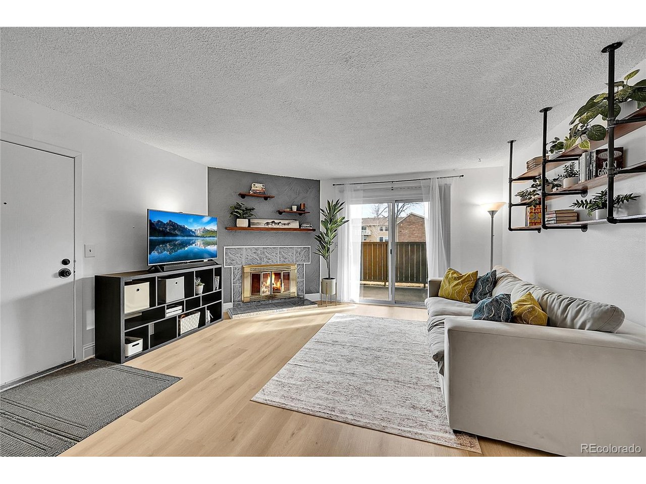 Undisclosed Address Wheat Ridge, CO 80033 - Photo 1 of 21 a living room with furniture and a couch