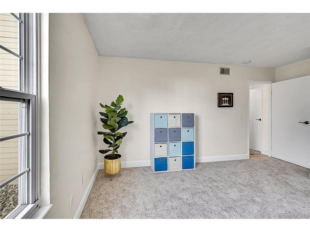 Undisclosed Address Wheat Ridge, CO 80033 - Photo 12 of 21 a view of a room with a potted plant