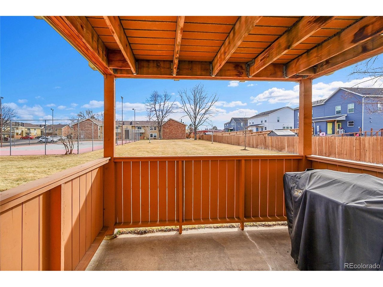 Undisclosed Address Wheat Ridge, CO 80033 - Photo 14 of 21 an outdoor view of building with yard