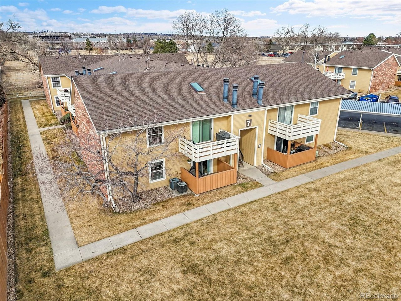 Undisclosed Address Wheat Ridge, CO 80033 - Photo 17 of 21 an aerial view of a house with a yard