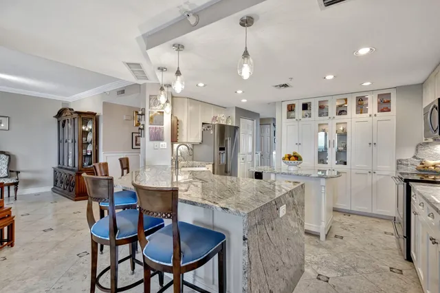 a view of a kitchen and dining area