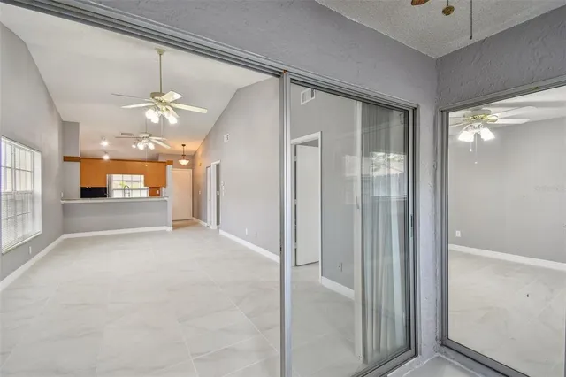 a view of a hallway with a chandelier
