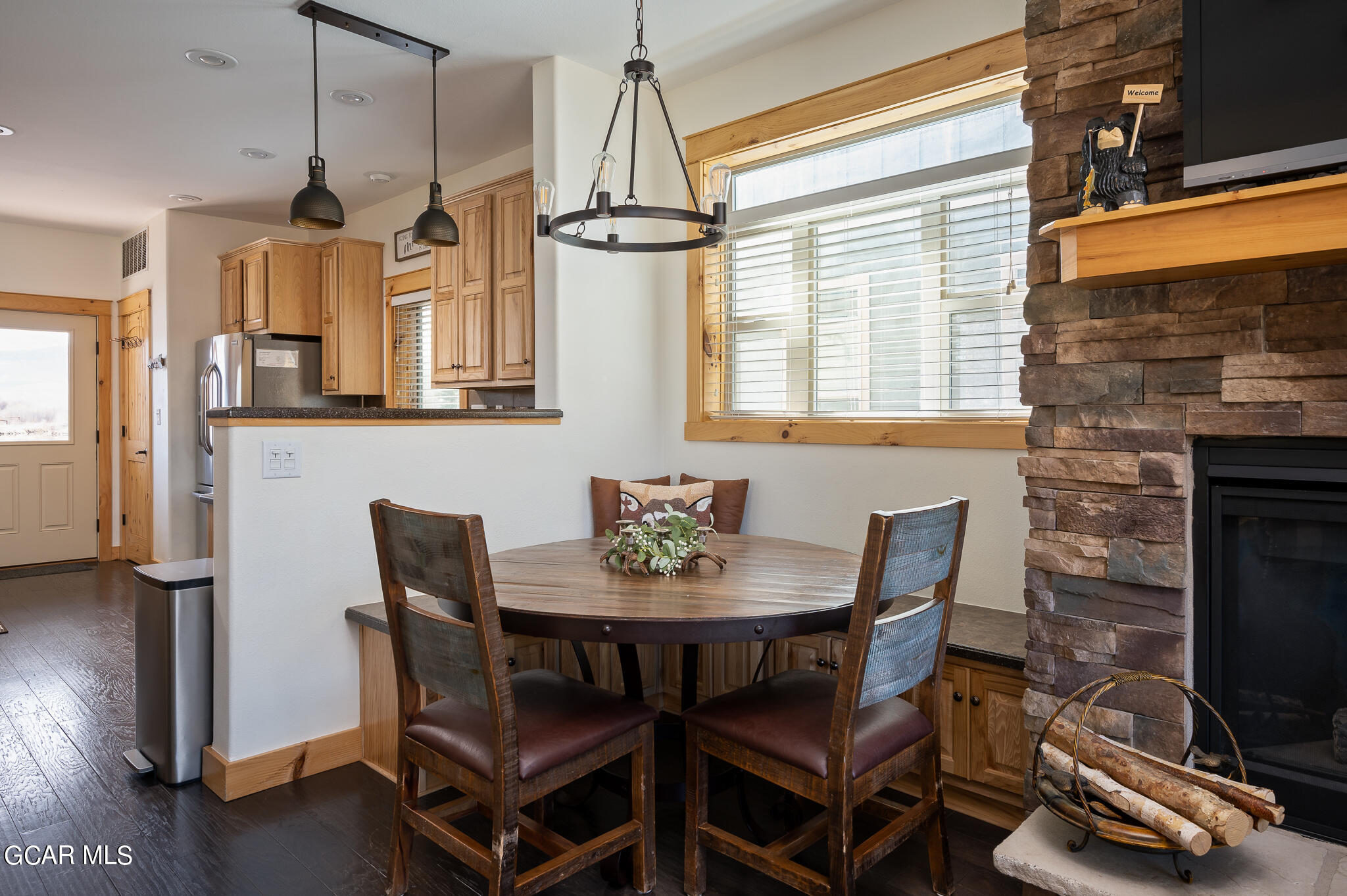 107 Edgewater Circle Granby, CO 80446 - Photo 11 of 51 a view of a dining room with furniture window and wooden floor