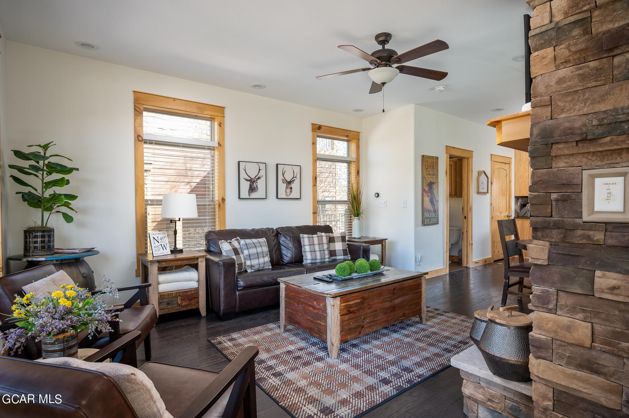 107 Edgewater Circle Granby, CO 80446 - Photo 18 of 51 a living room with furniture and a potted plant