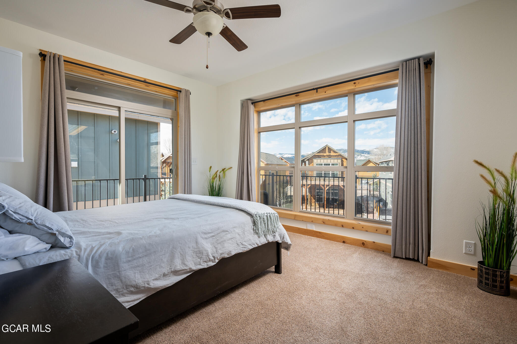 107 Edgewater Circle Granby, CO 80446 - Photo 24 of 51 a bedroom with a large bed and a large window