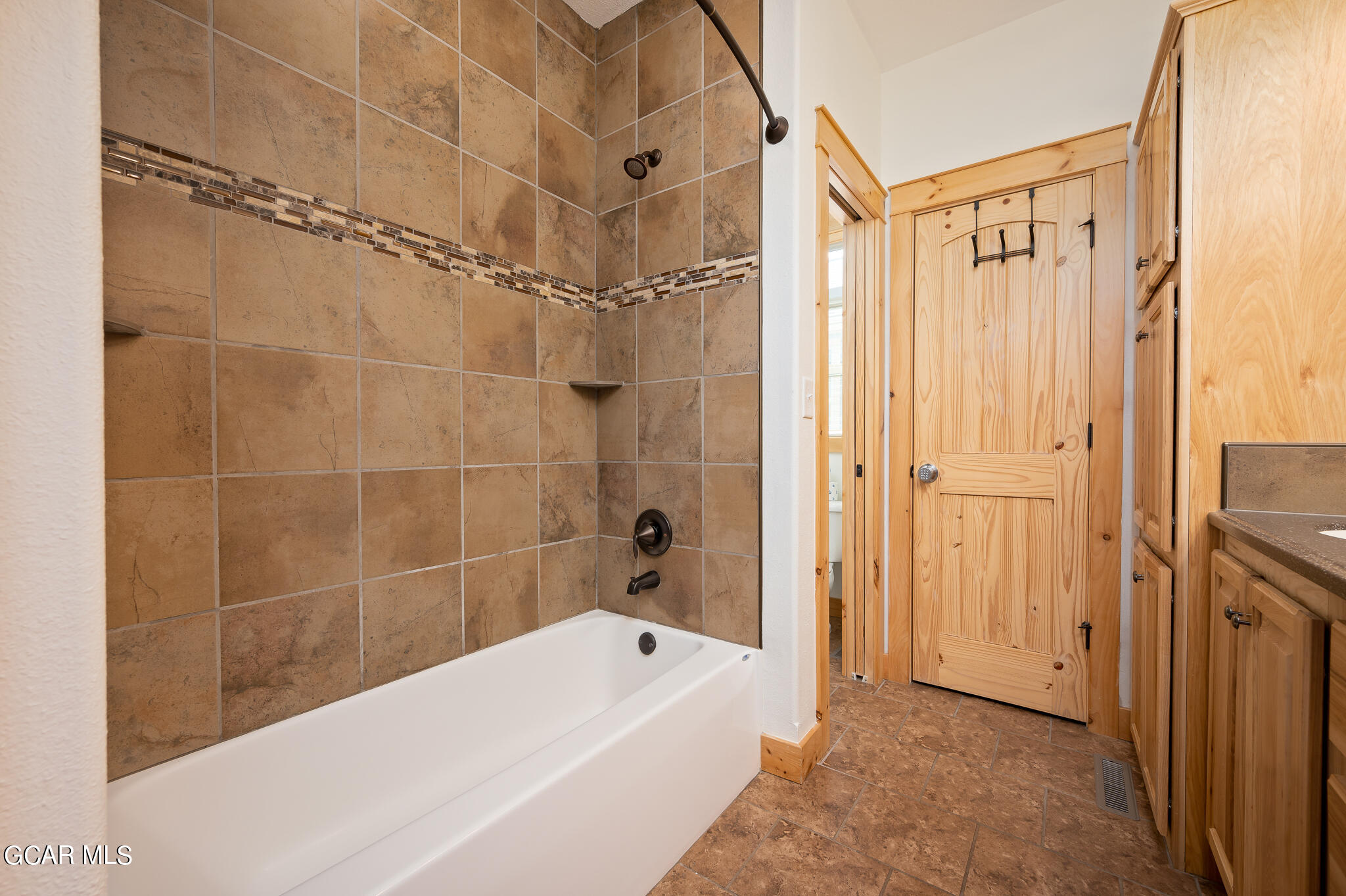 107 Edgewater Circle Granby, CO 80446 - Photo 28 of 51 a bathroom with a shower a bathtub and a shower