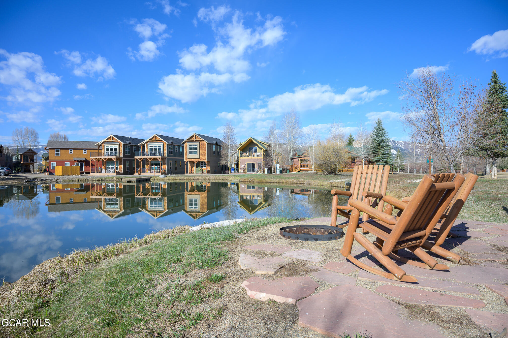 107 Edgewater Circle Granby, CO 80446 - Photo 44 of 51 a view of a chairs and table in a backyard