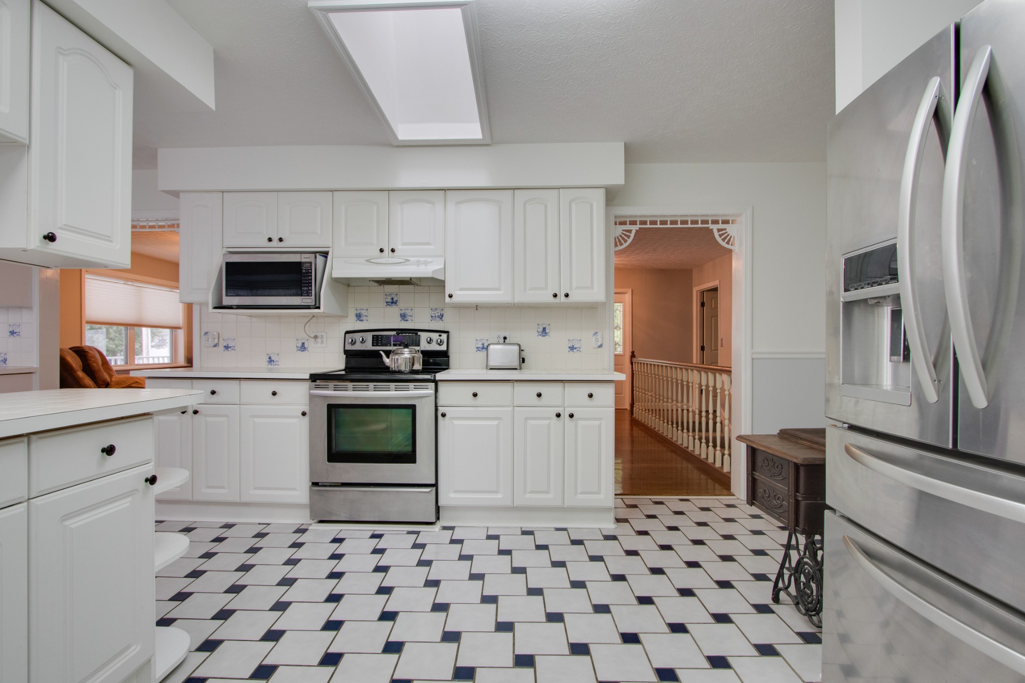 481 Goad Ridge Lane Pleasant Shade, TN 37145 - Photo 8 of 28 a kitchen with granite countertop a refrigerator stove and sink