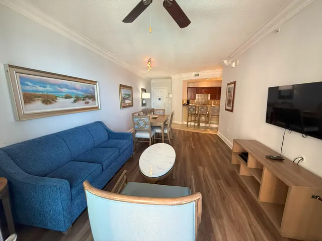 a living room with furniture and a flat screen tv