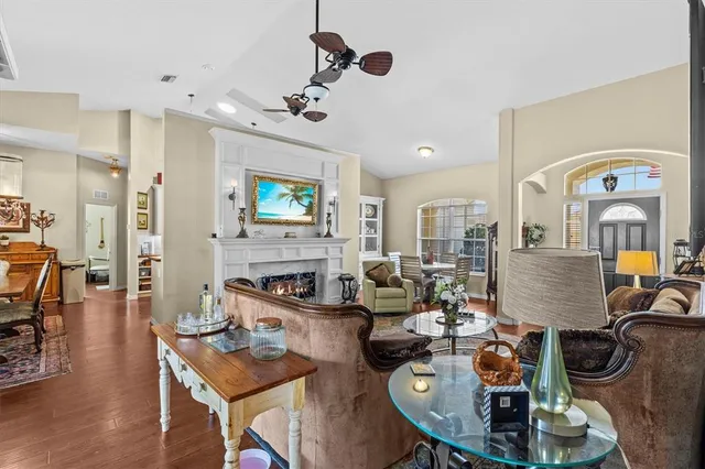 a living room with fireplace furniture and a flat screen tv