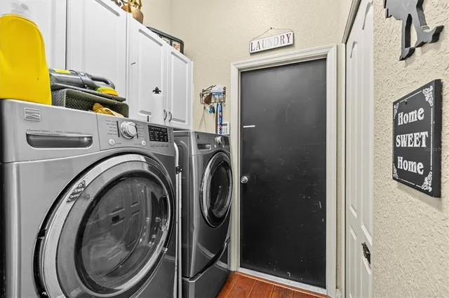 a utility room with dryer and washer