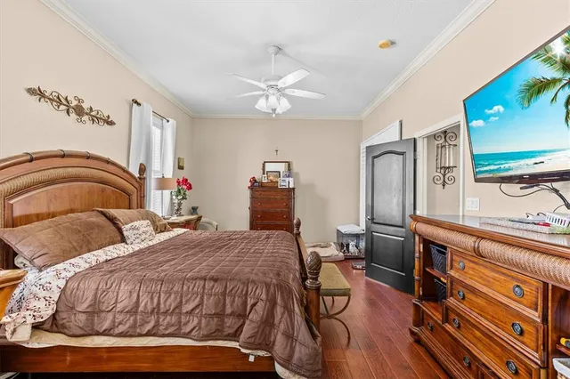 a bedroom with a bed dresser and a window