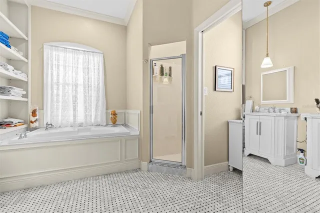 a bathroom with a bathtub and next to a window