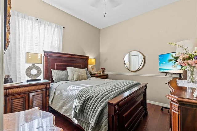 a bedroom with bed and dresser