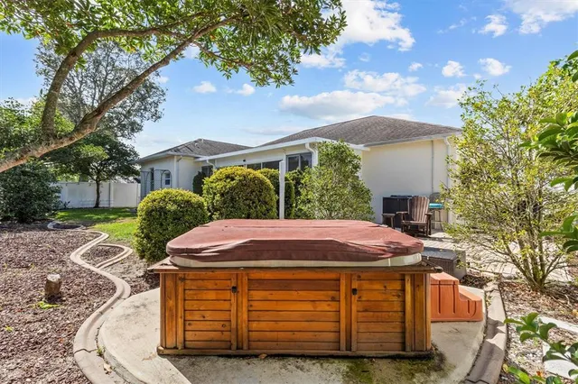 a view of a house with patio and wooden floor