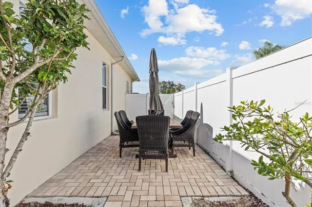 an aerial view of multiple houses with yard