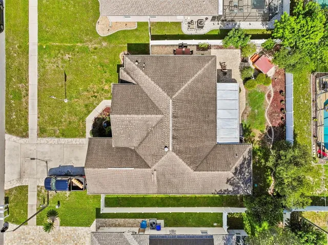 an aerial view of a house with a garden and plants