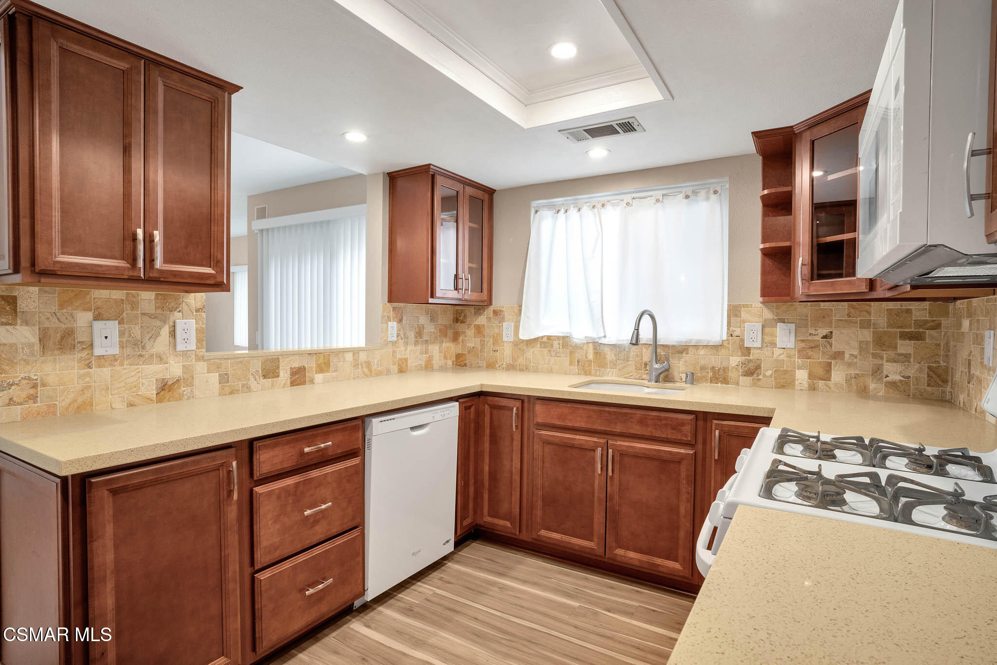 4492 Apricot Road, Unit B Simi Valley, CA 93063 - Photo 13 of 28 a kitchen with a sink stove and cabinets