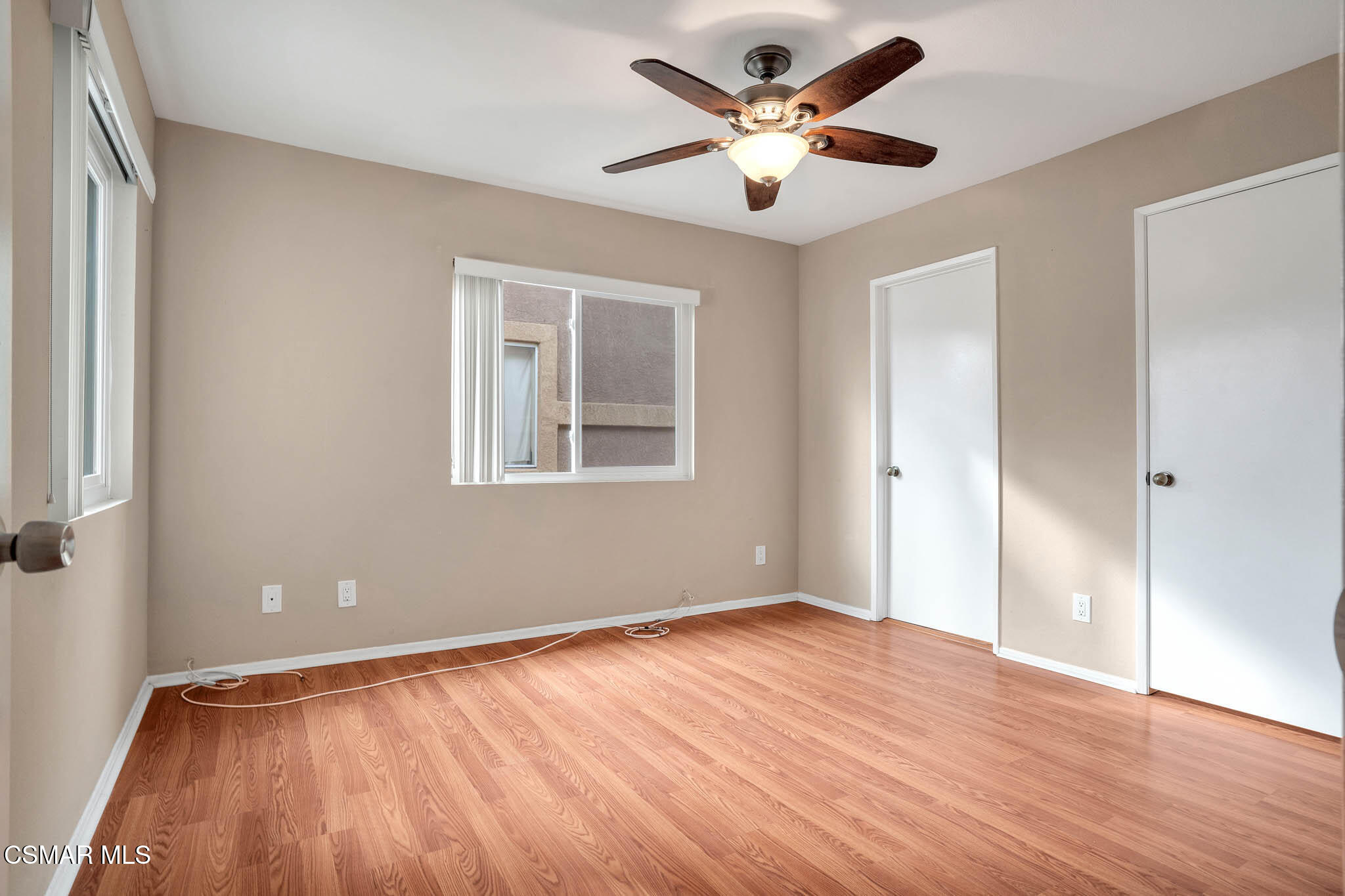 4492 Apricot Road, Unit B Simi Valley, CA 93063 - Photo 18 of 28 a view of an empty room with wooden floor and a window