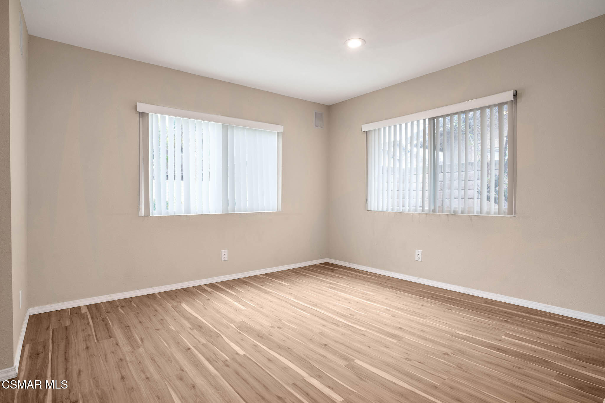4492 Apricot Road, Unit B Simi Valley, CA 93063 - Photo 8 of 28 a view of an empty room with wooden floor and a window
