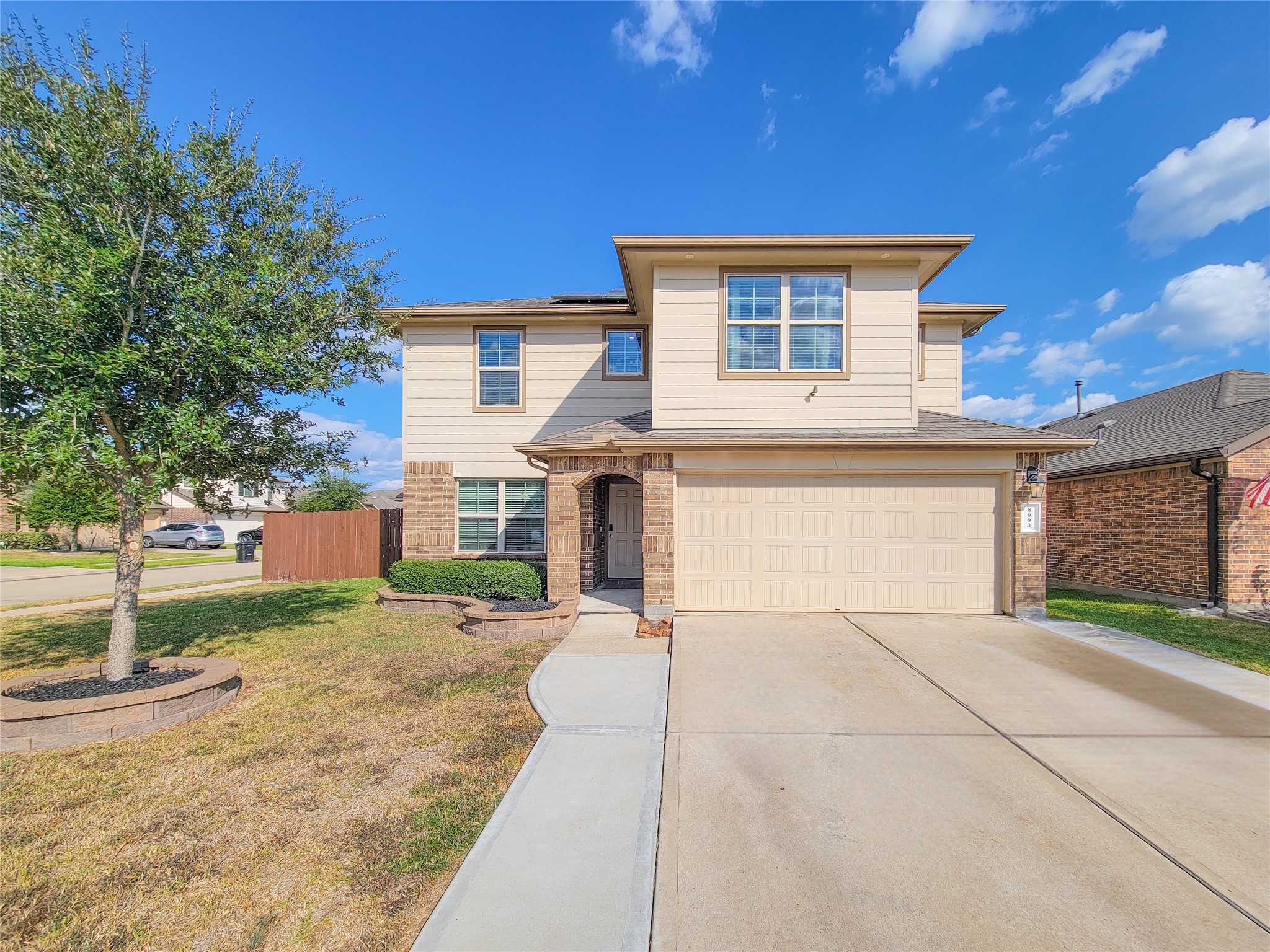 8003 Ecru Lane Rosharon, TX 77583 - Photo 2 of 43 a front view of a house with a yard and garage