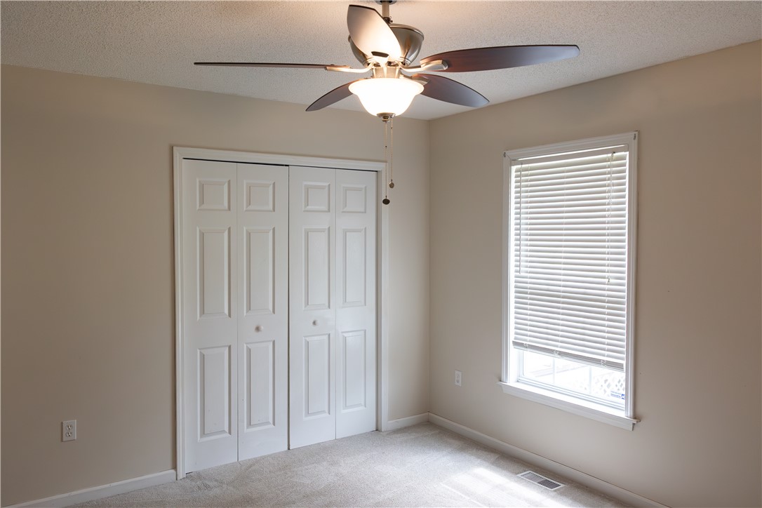 439 Chetola Road Seneca, SC 29672 - Photo 16 of 28 Plush carpeting and a classic multi-panel closet door define this versatile auxiliary bedroom space.